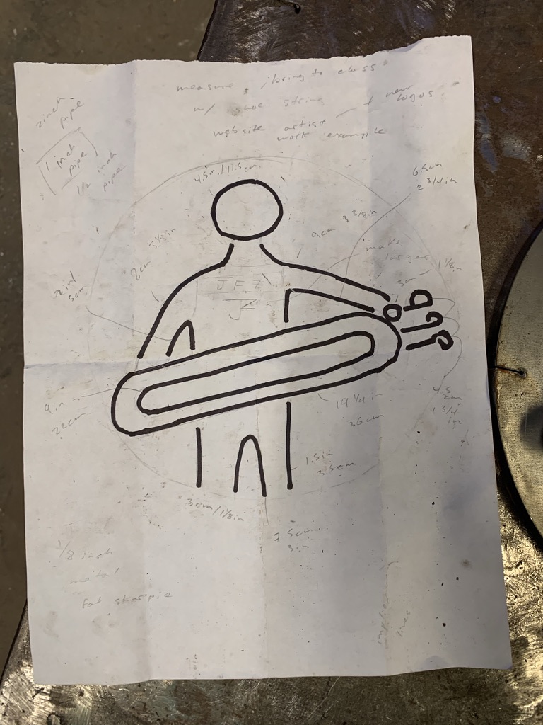 Hand-drawn design sketch with measurements for the branding iron logo